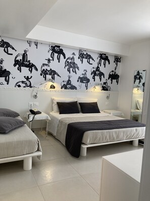 Triple Room | Minibar, in-room safe, desk, blackout curtains