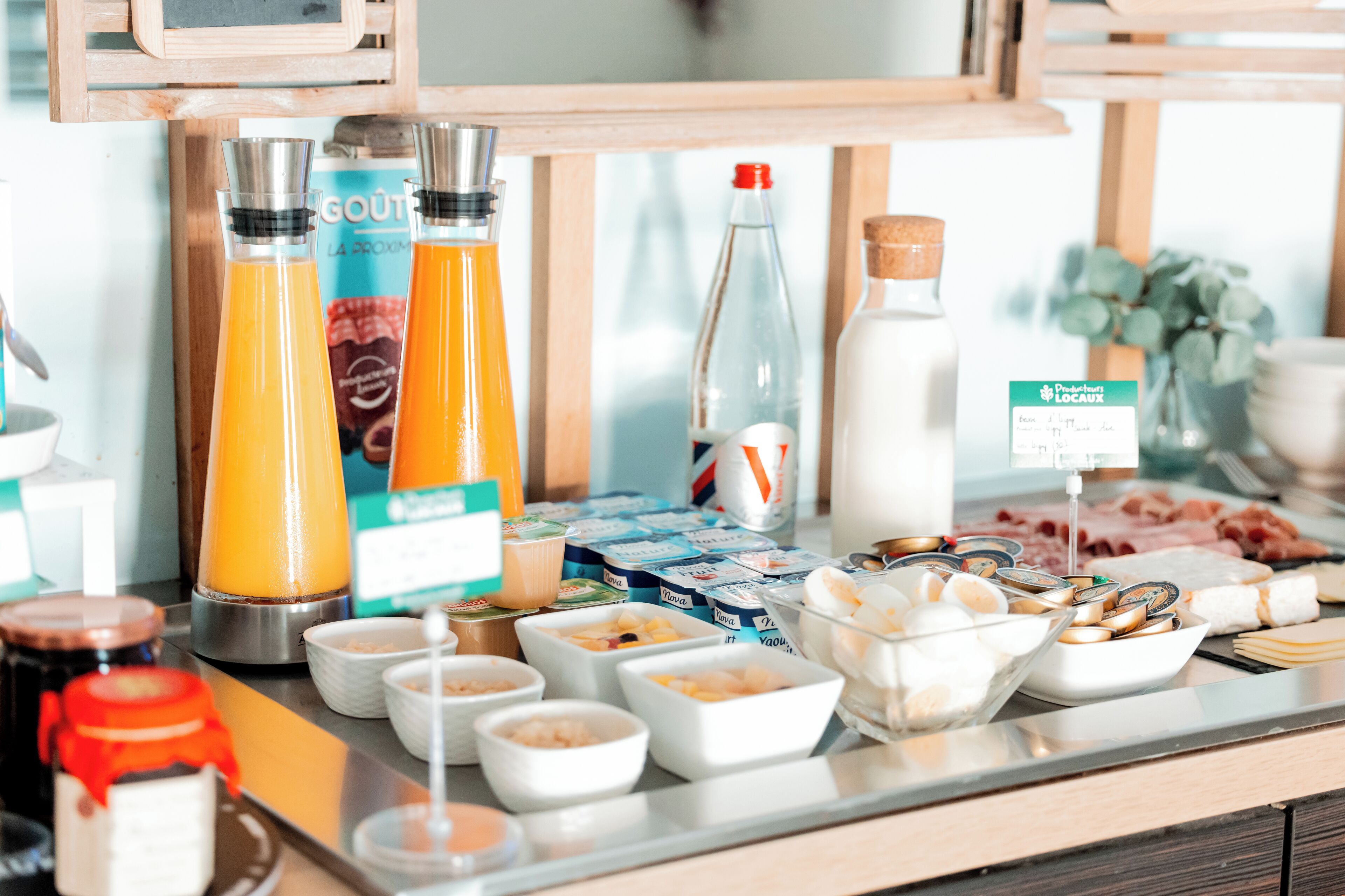 A breakfast buffet with various food items and beverages.