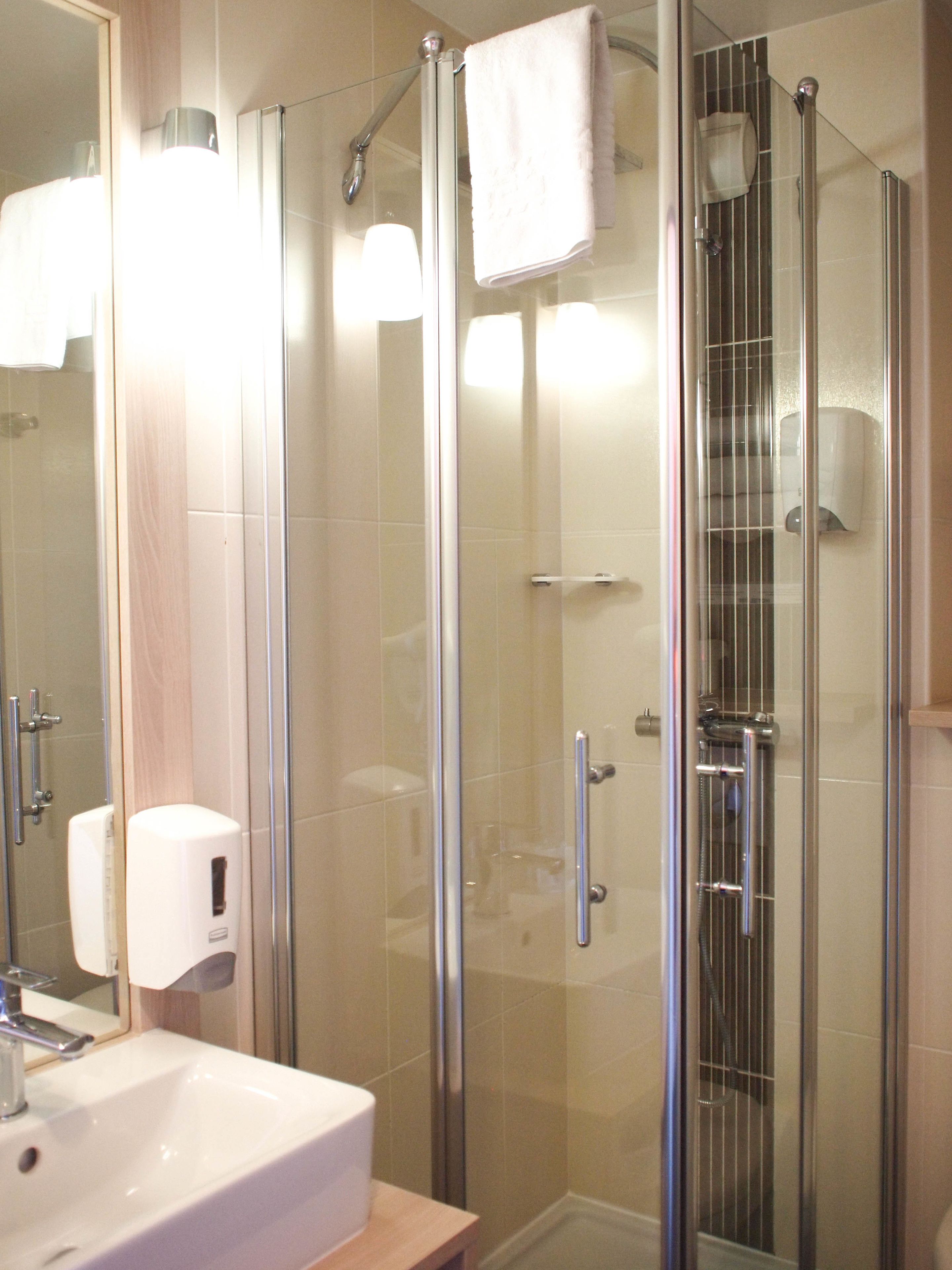 shower, free toiletries, hair dryer, towels