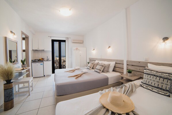 Deluxe Triple Room, Sea View | Premium bedding, memory foam beds, individually decorated