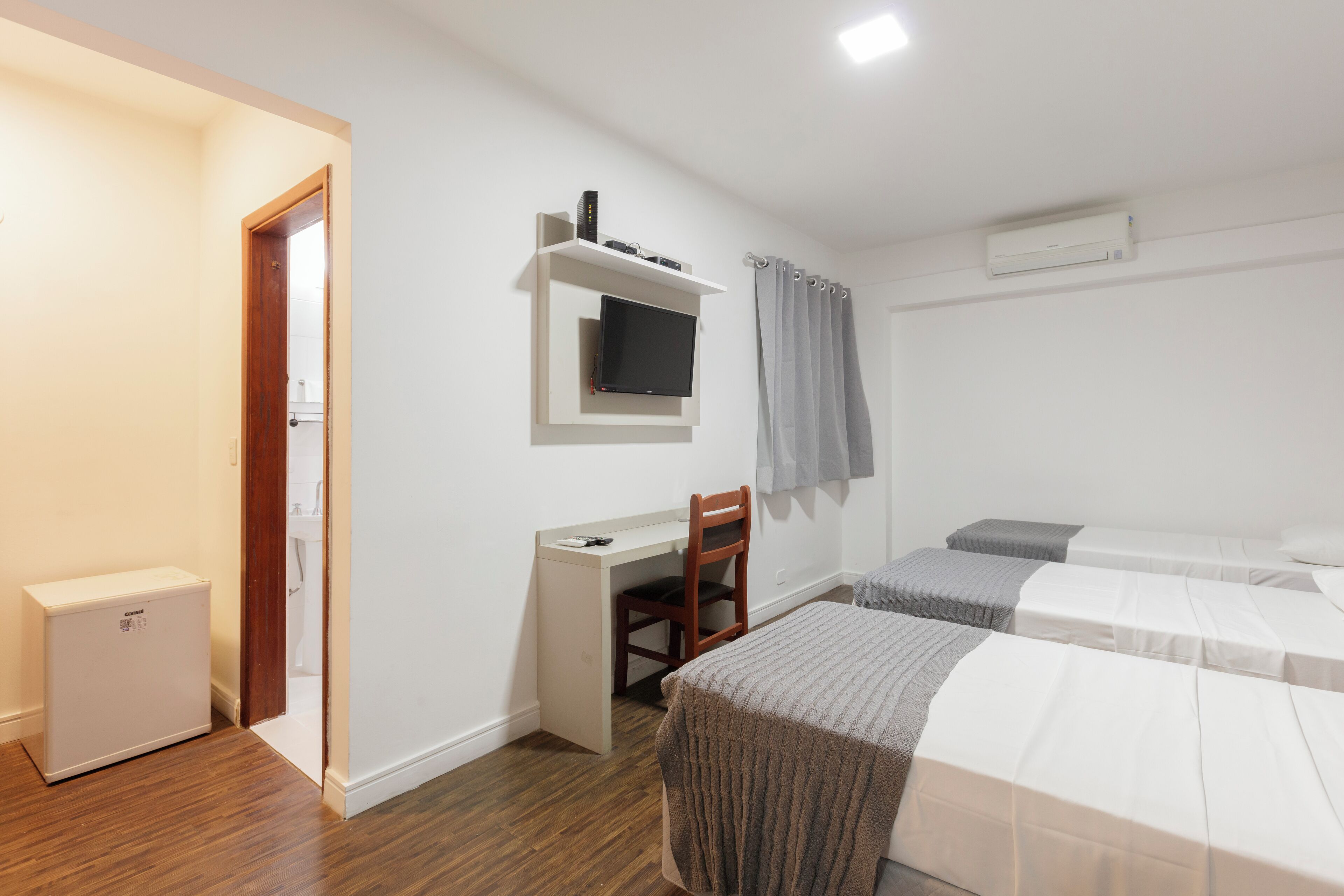 Triple Room | Minibar, desk, blackout curtains, free WiFi