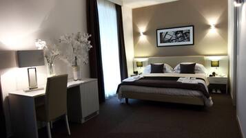 Habitación familiar | Ropa de cama de alta calidad y minibar