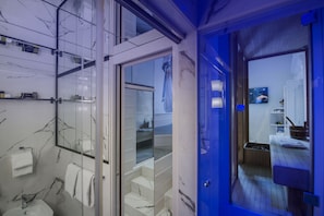 Suite, 1 King Bed | Bathroom | Shower, rainfall showerhead, free toiletries, hair dryer