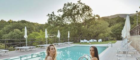 Seasonal outdoor pool, open 9 AM to 7 PM, sun loungers