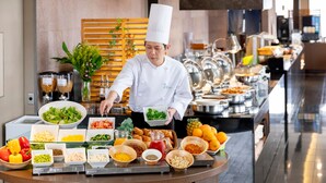 A buffet setup with various food items and a chef serving. - Holiday Inn ANA Kanazawa Sky by IHG (Kanazawa)