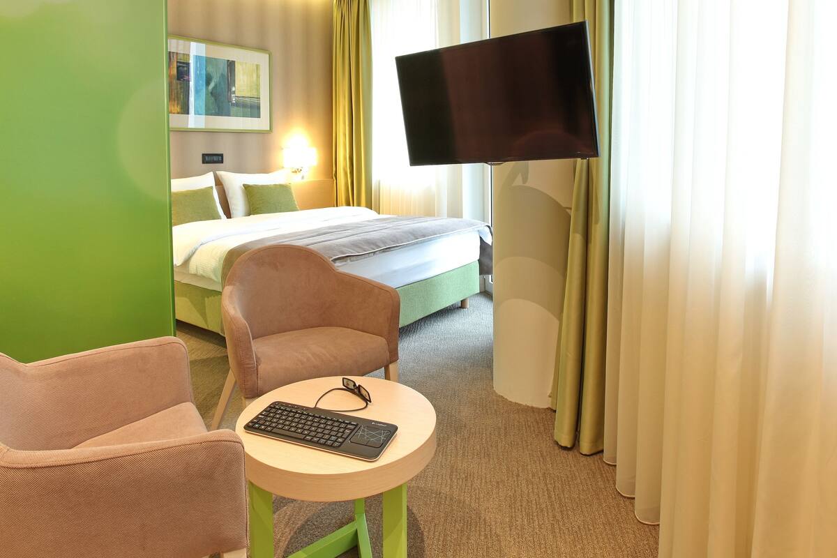 Superior Double Room | Minibar, in-room safe, desk, laptop workspace