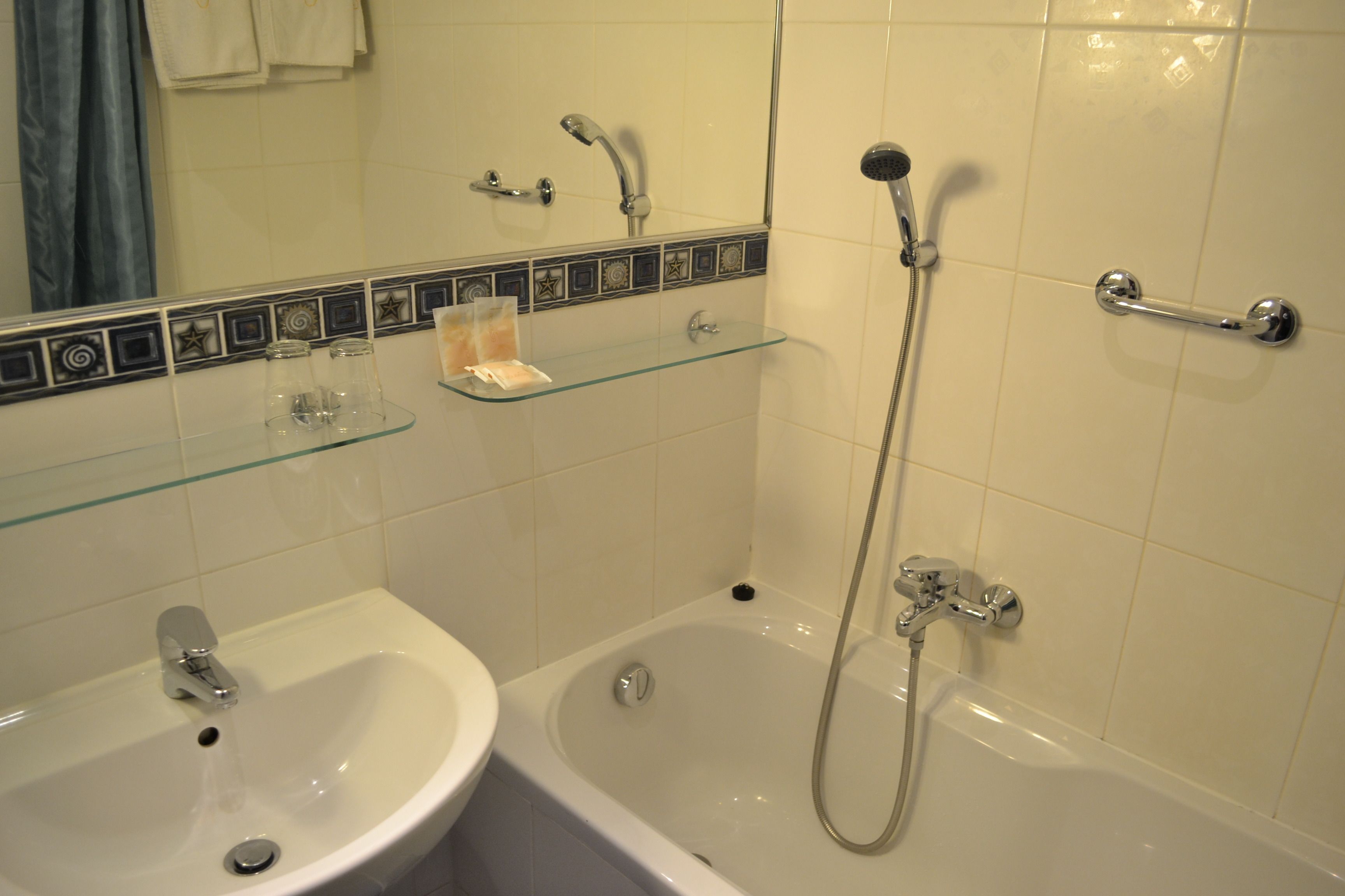 bathtub, free toiletries, hair dryer, towels