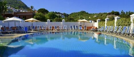 Indoor pool, outdoor pool, pool umbrellas, sun loungers