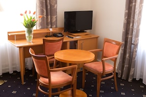 Standard Triple Room | Living area | TV