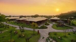 A resort with multiple bungalow-style accommodations, a central gazebo, and a well-maintained garden. - Bagan Lodge (Nyaung-U)