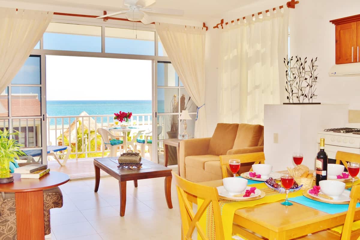 family suite, 2 bedrooms, partial ocean view | living room