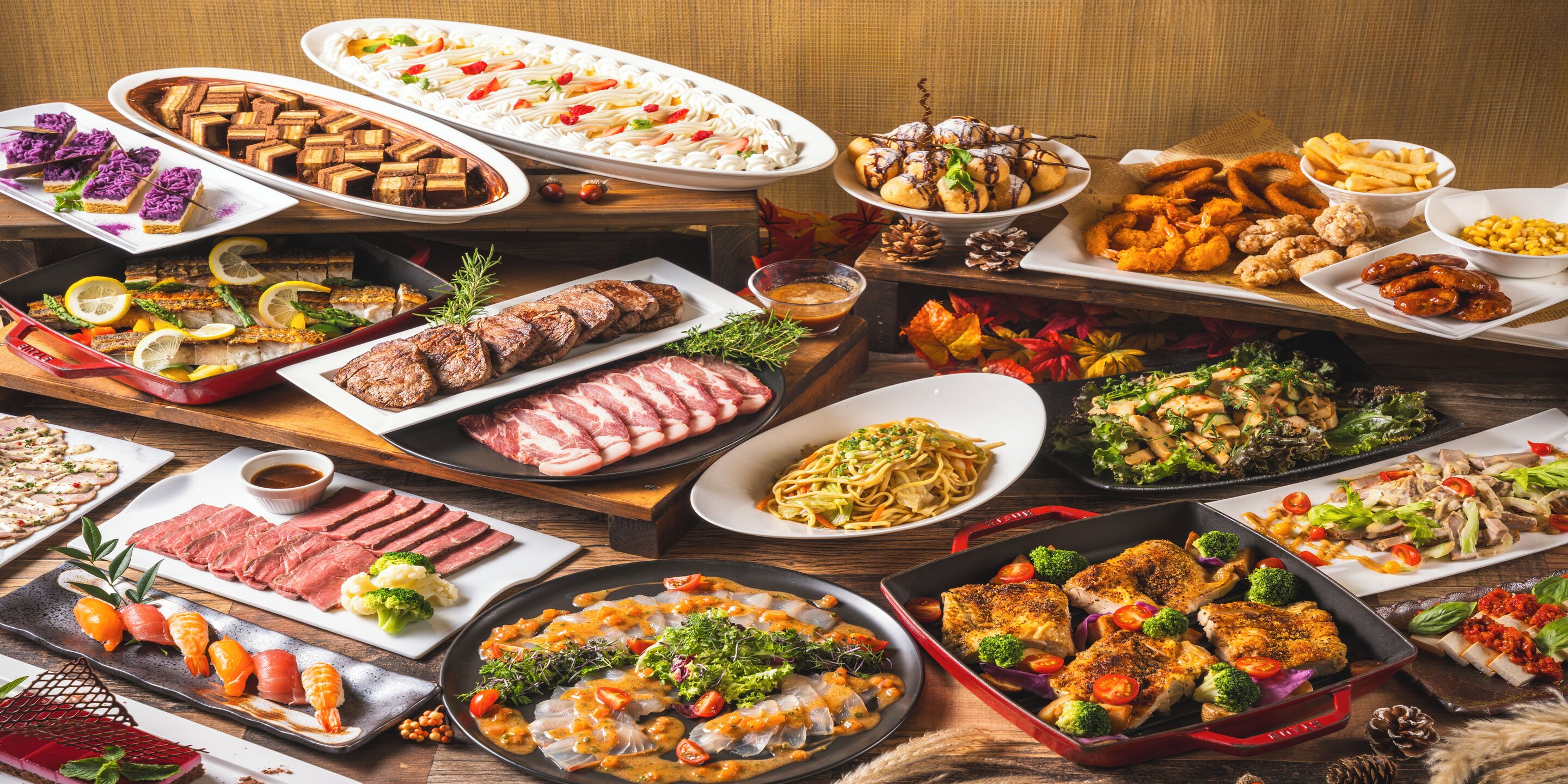 A variety of dishes on a buffet table, including meats, seafood, and salads.