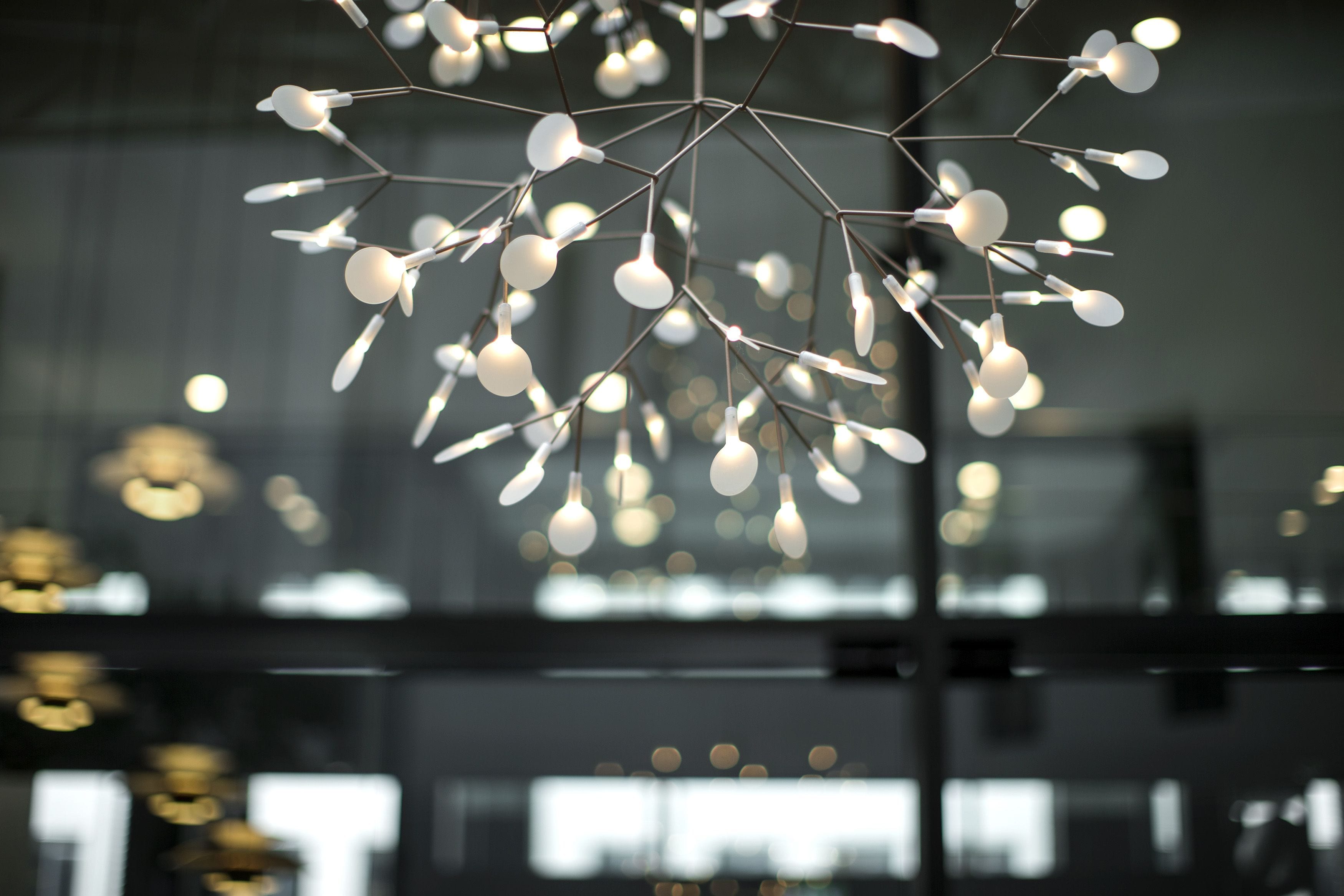 A chandelier with multiple spherical bulbs suspended from a metal frame.