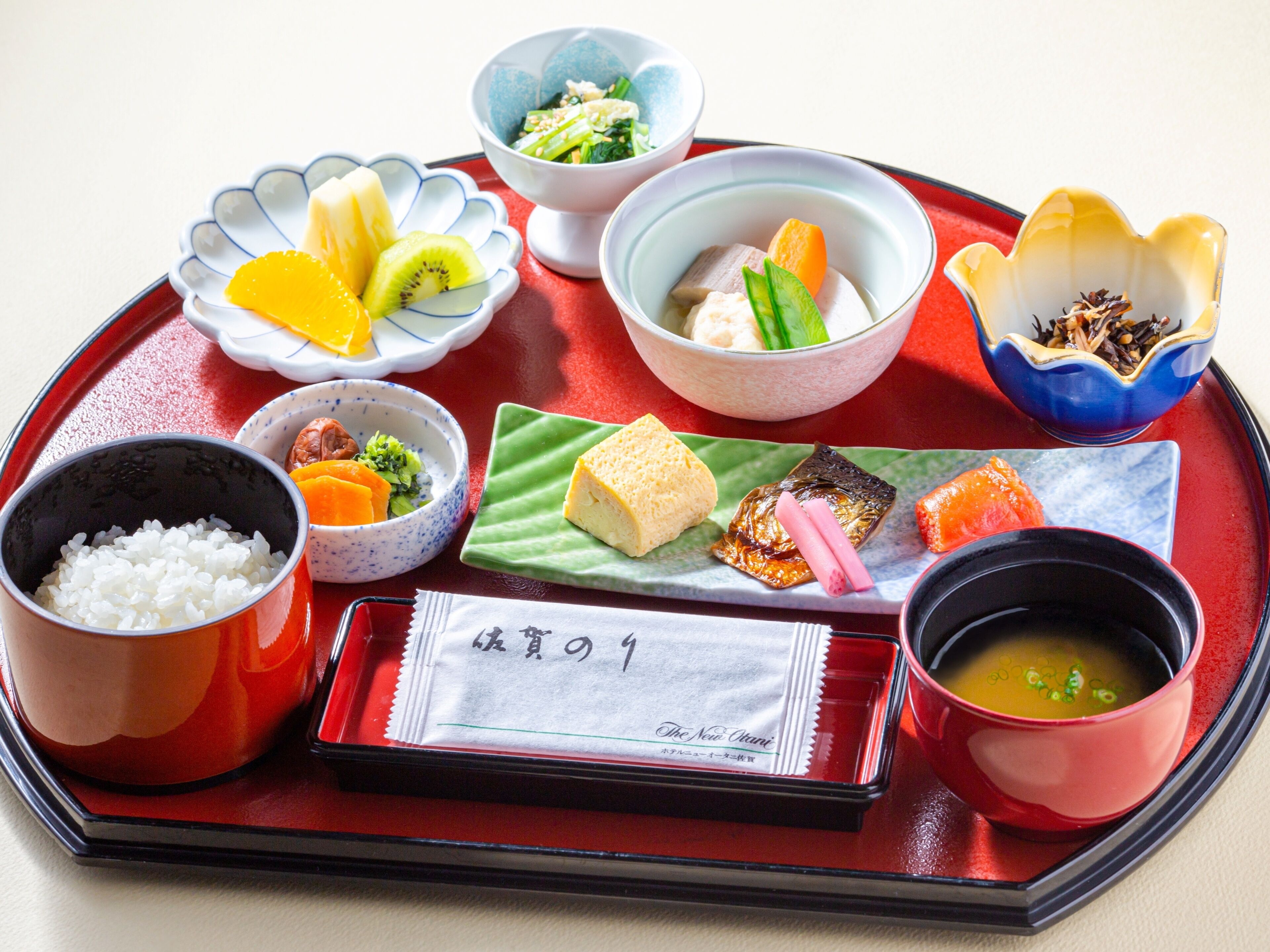 A traditional Japanese meal with various dishes on a tray.