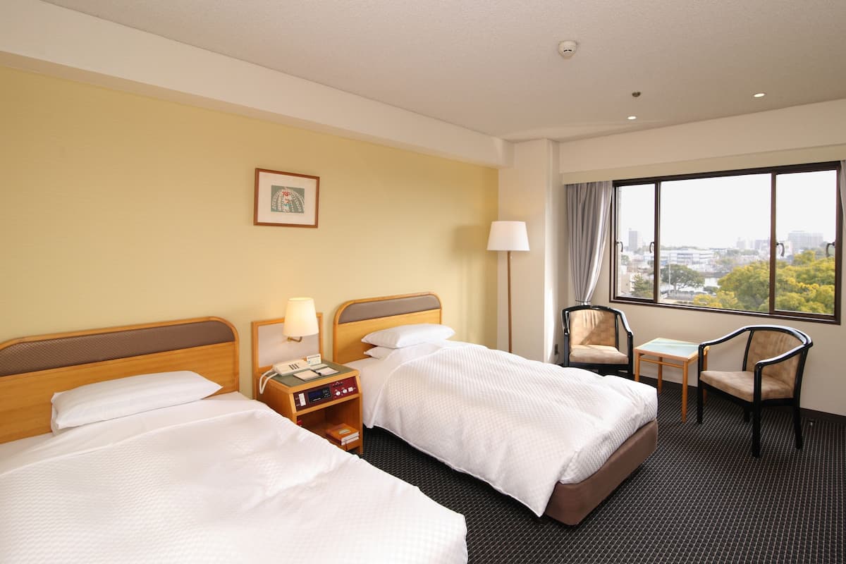 Premium bedding, down duvets, in-room safe, desk