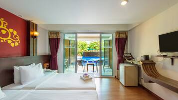 Deluxe Room, Pool Access | 1 bedroom, in-room safe, blackout drapes, free WiFi