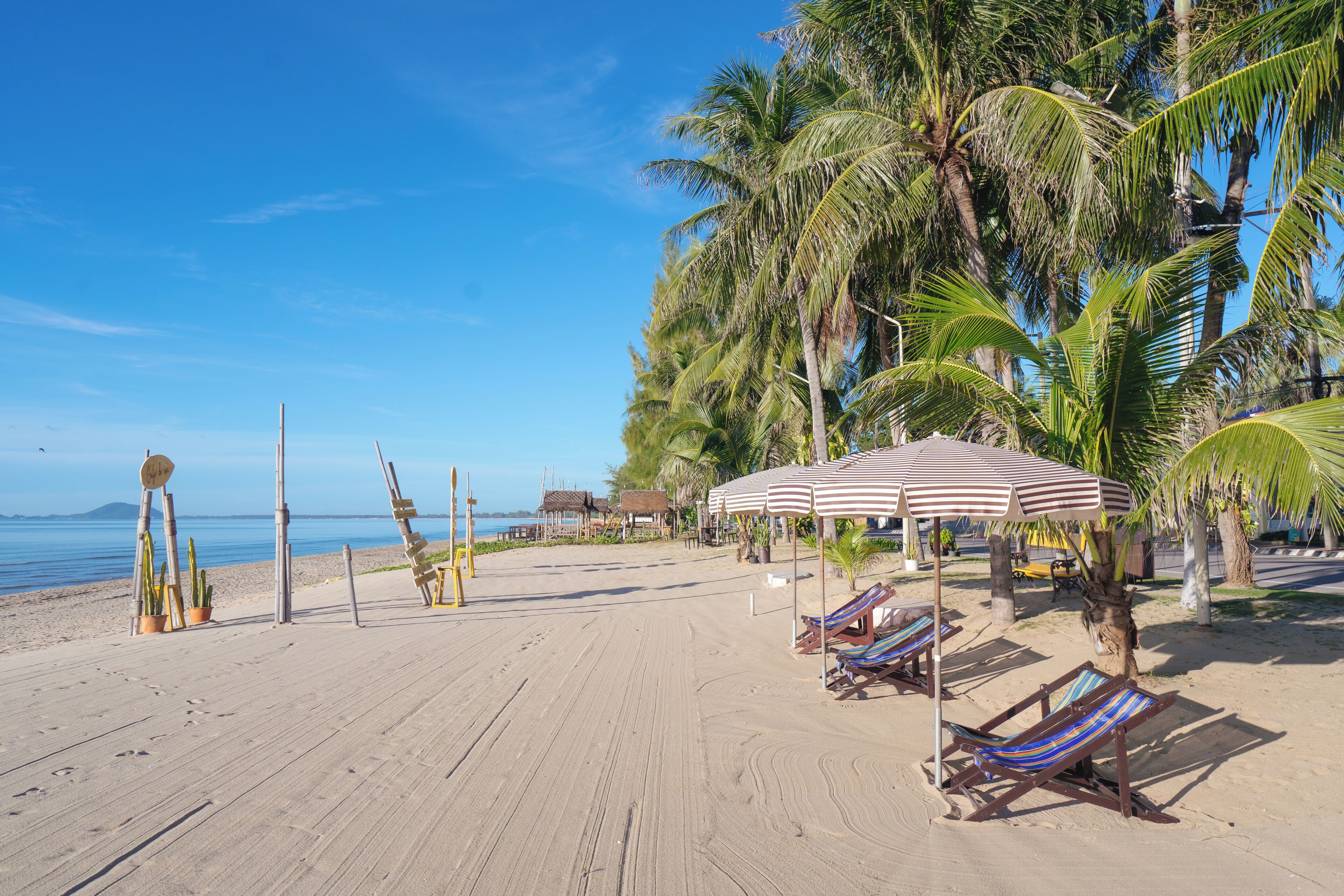 On the beach, sun-loungers, beach umbrellas, beach towels