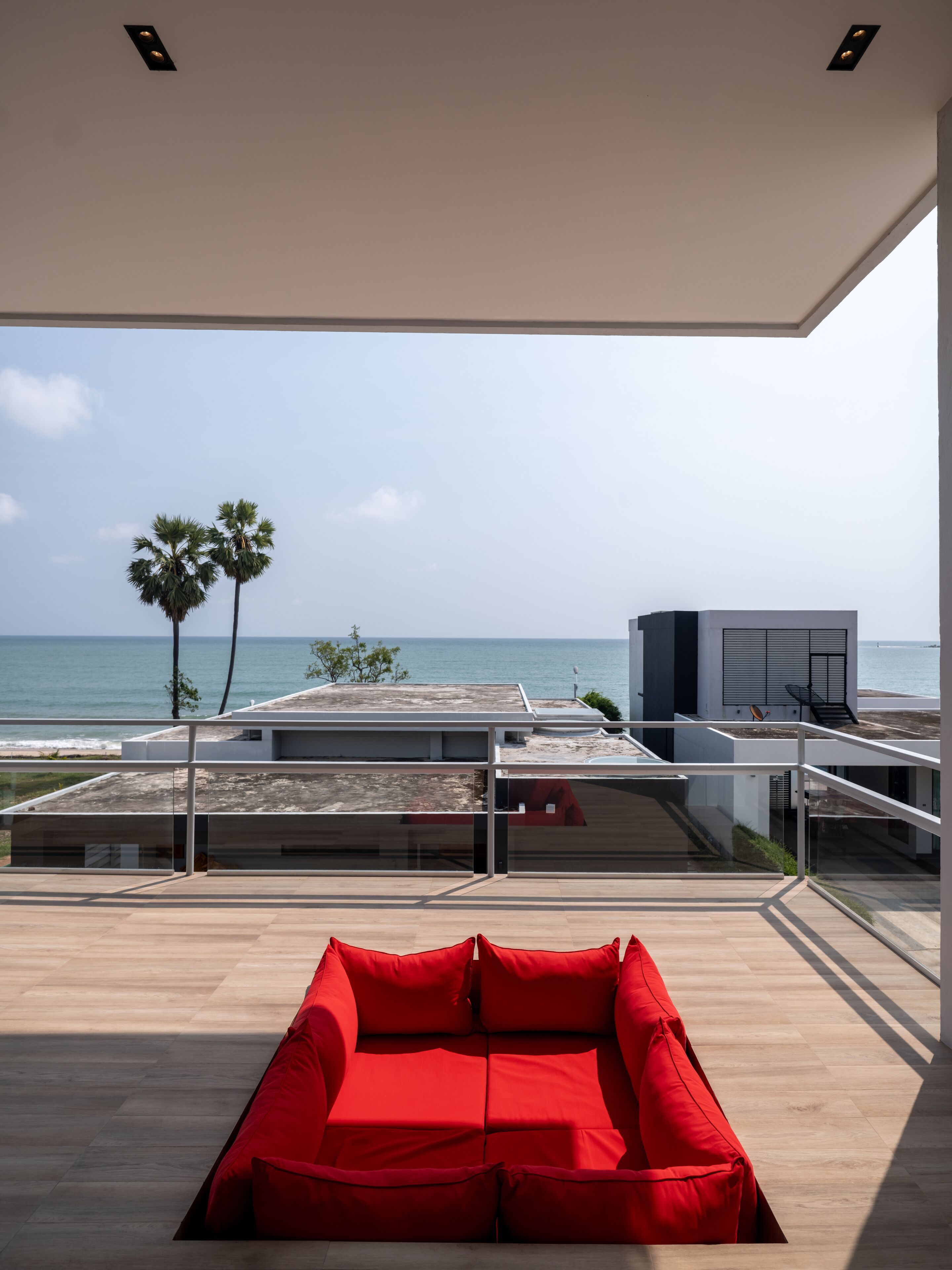 ocean view pool villa | living area | books