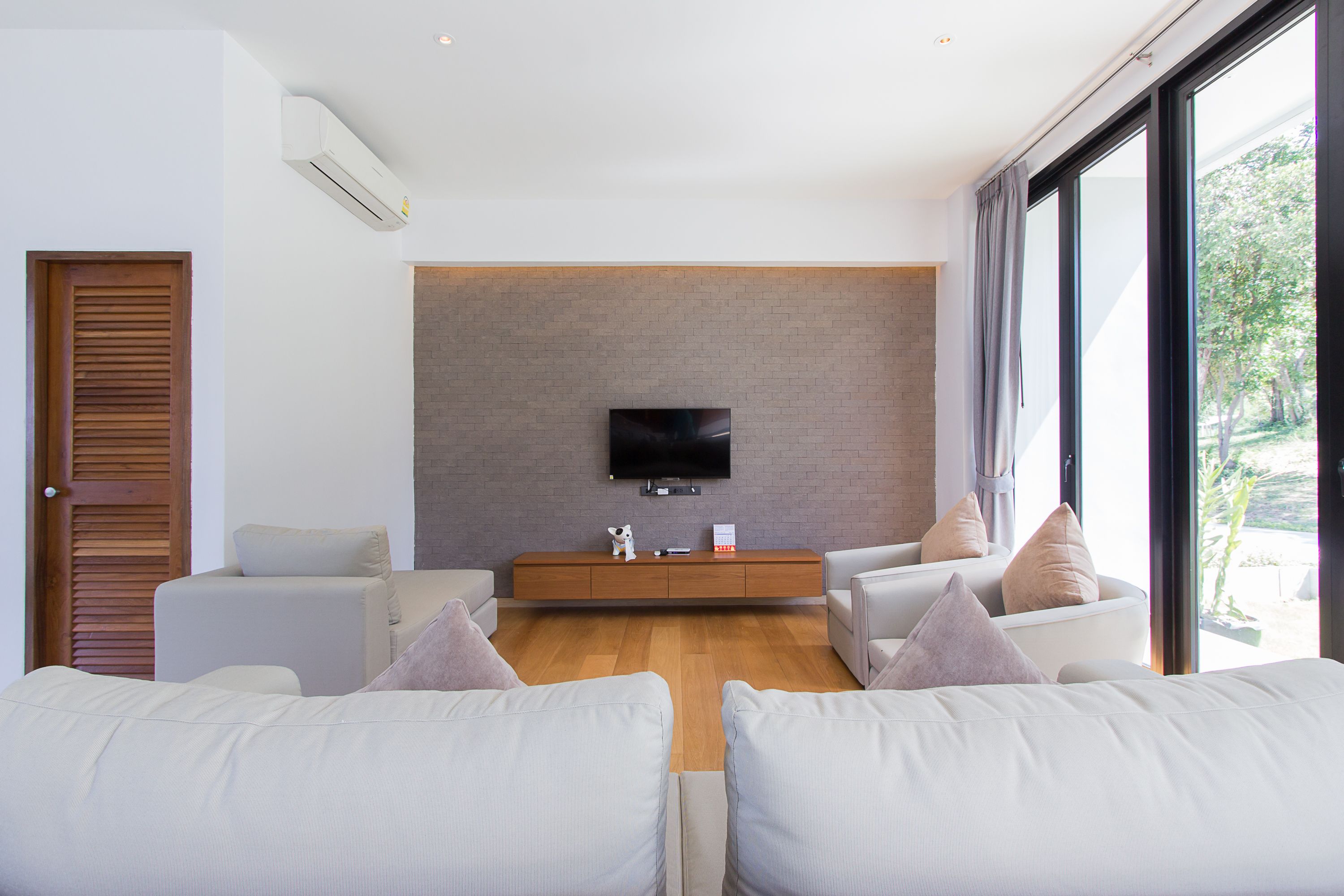 three bedroom beachfront pool villa  | living room | books