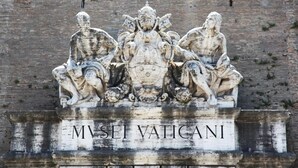 A stone relief sculpture with inscriptions on a weathered wall. - Vaticano84 (Rome)