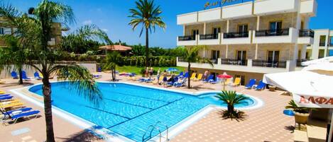 Seasonal outdoor pool, open 8:00 AM to 8:00 PM, pool umbrellas