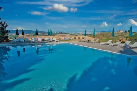 Seasonal outdoor pool, pool umbrellas, sun loungers
