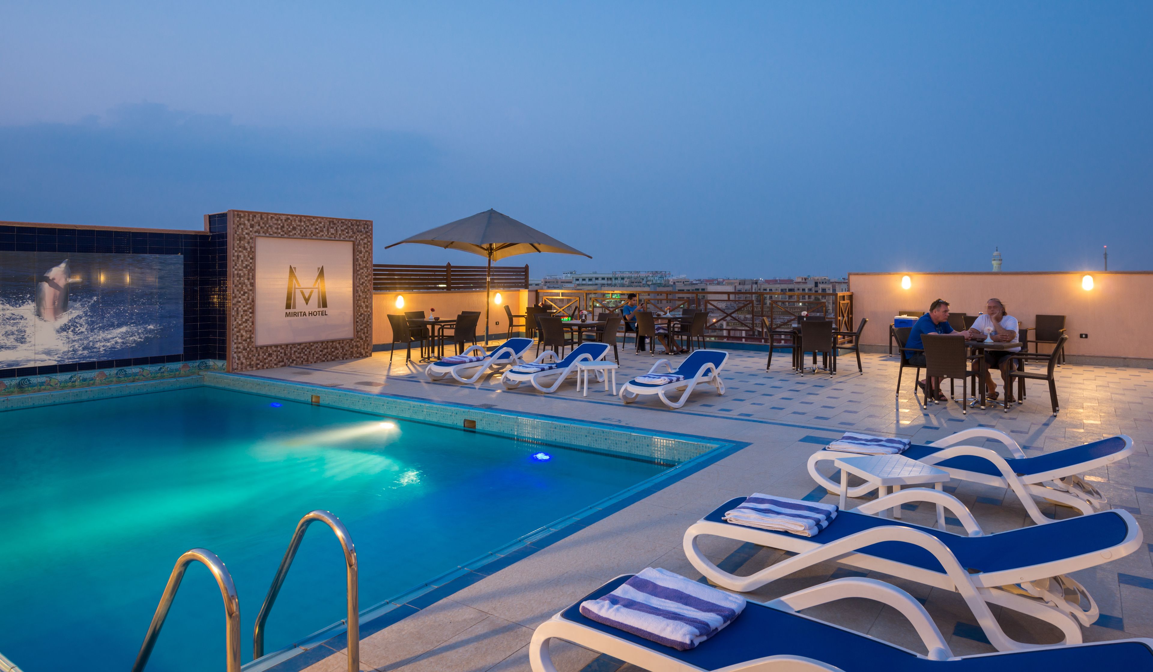 Outdoor pool, pool umbrellas, sun loungers