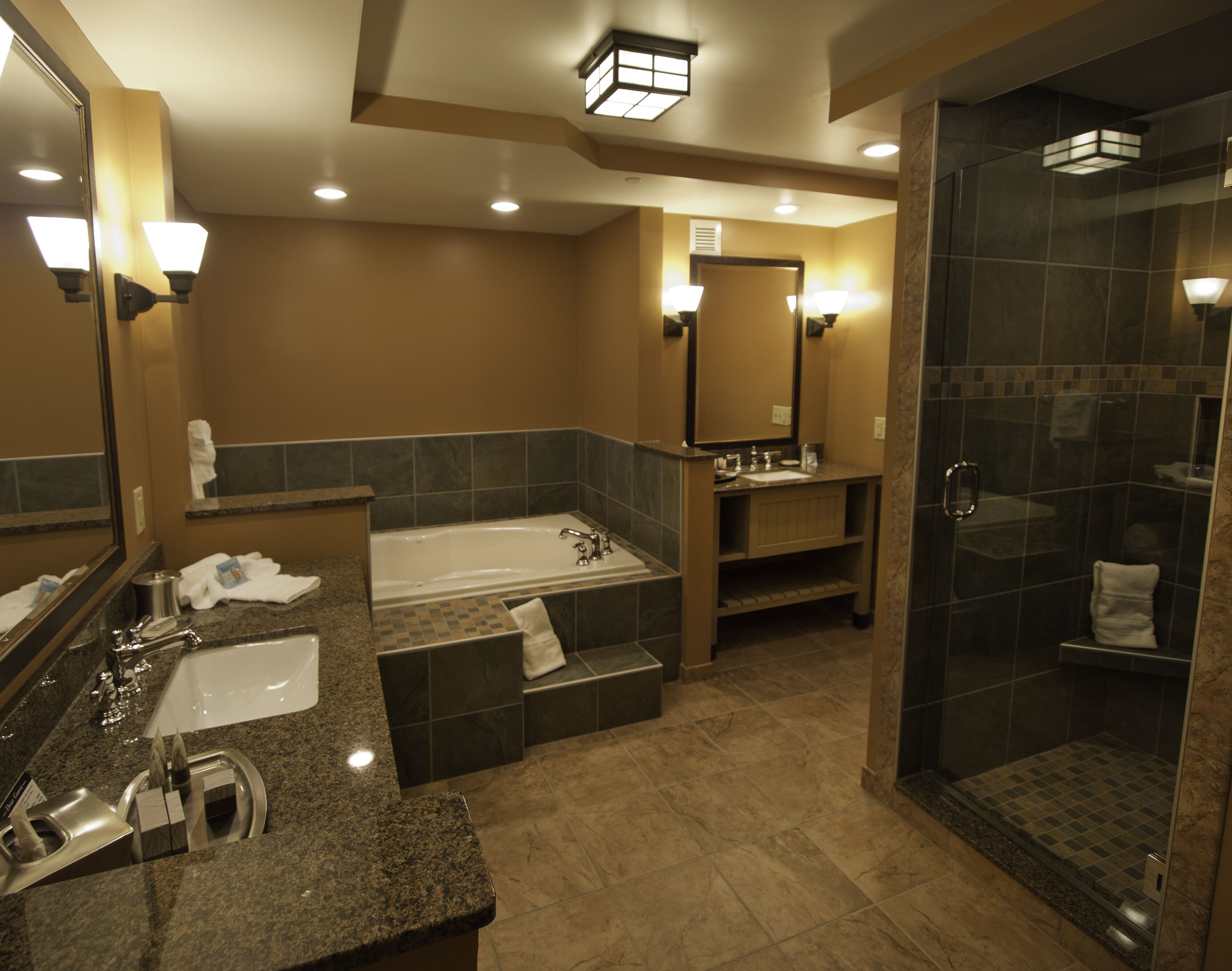 double queen village view jacuzzi suite | bathroom | shower, free toiletries, bathrobes, slippers