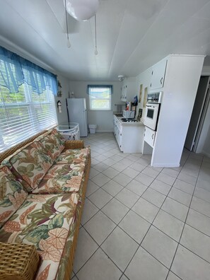 One Bedroom Cottage with King Bed | Living area | TV - Tropical Winds Motel & Cottages (Sanibel)
