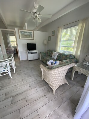 Ocean View Efficiency One Bedroom | Living area | TV - Tropical Winds Motel & Cottages (Sanibel)
