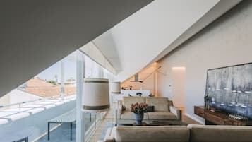 Penthouse, 2 Bedrooms, Balcony, City View | Living area | 24-inch LCD TV with cable channels, TV, pay movies