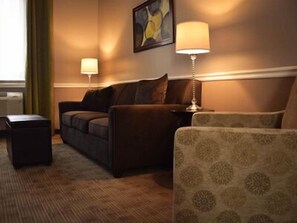 Superior Suite, 1 King Bed, Jetted Tub | Living room | Flat-screen TV