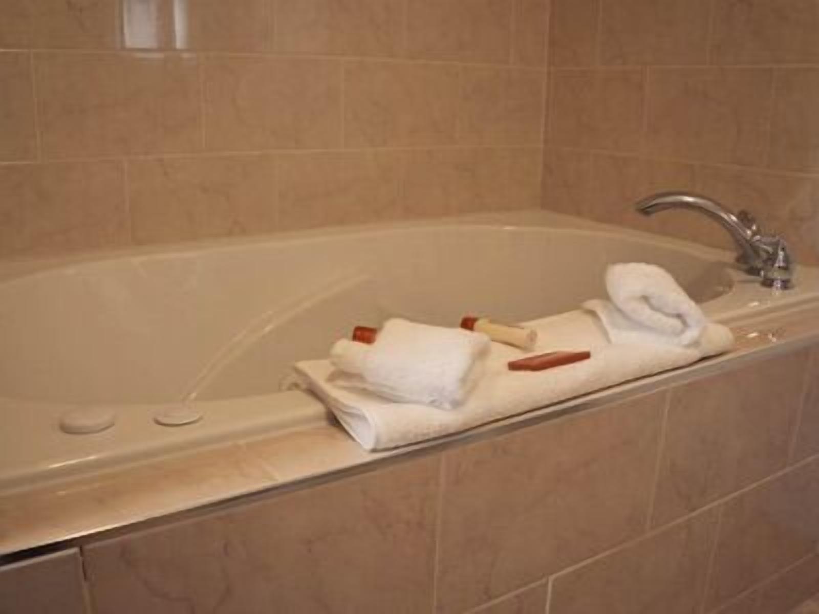 superior suite, 1 king bed, jetted tub | jetted bathtub