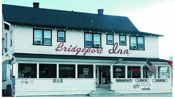 A two-story building with a sign reading "Bridgeport Inn." - Bridgeport Inn (Bridgeport)