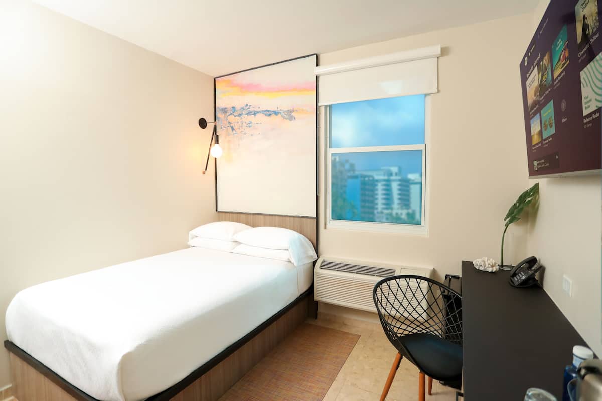 Tryst Petite Full | Premium bedding, pillowtop beds, blackout drapes, free WiFi