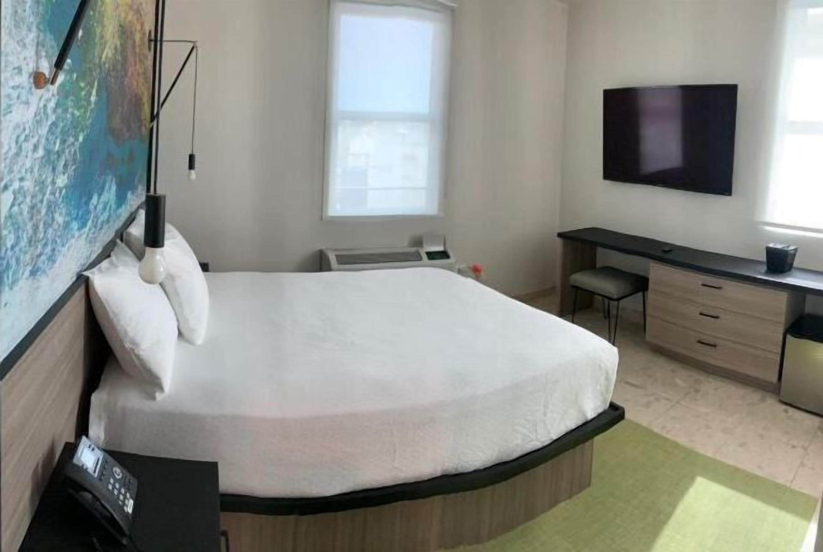 Premium bedding, pillow-top beds, blackout curtains, free WiFi