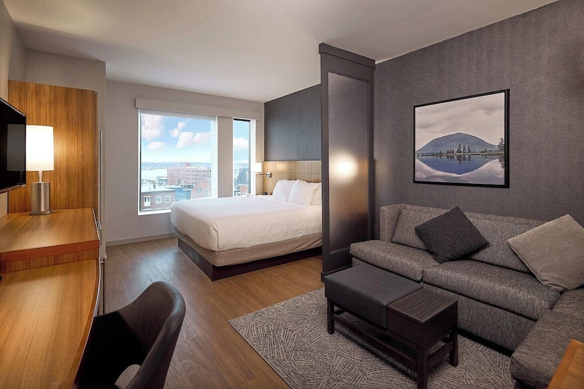 Premium bedding, desk, laptop workspace, soundproofing