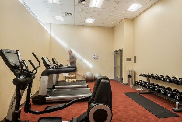 A gym with treadmills, dumbbells, and exercise balls. - Hyatt Place Portland Downtown - Old Port Square (Portland)