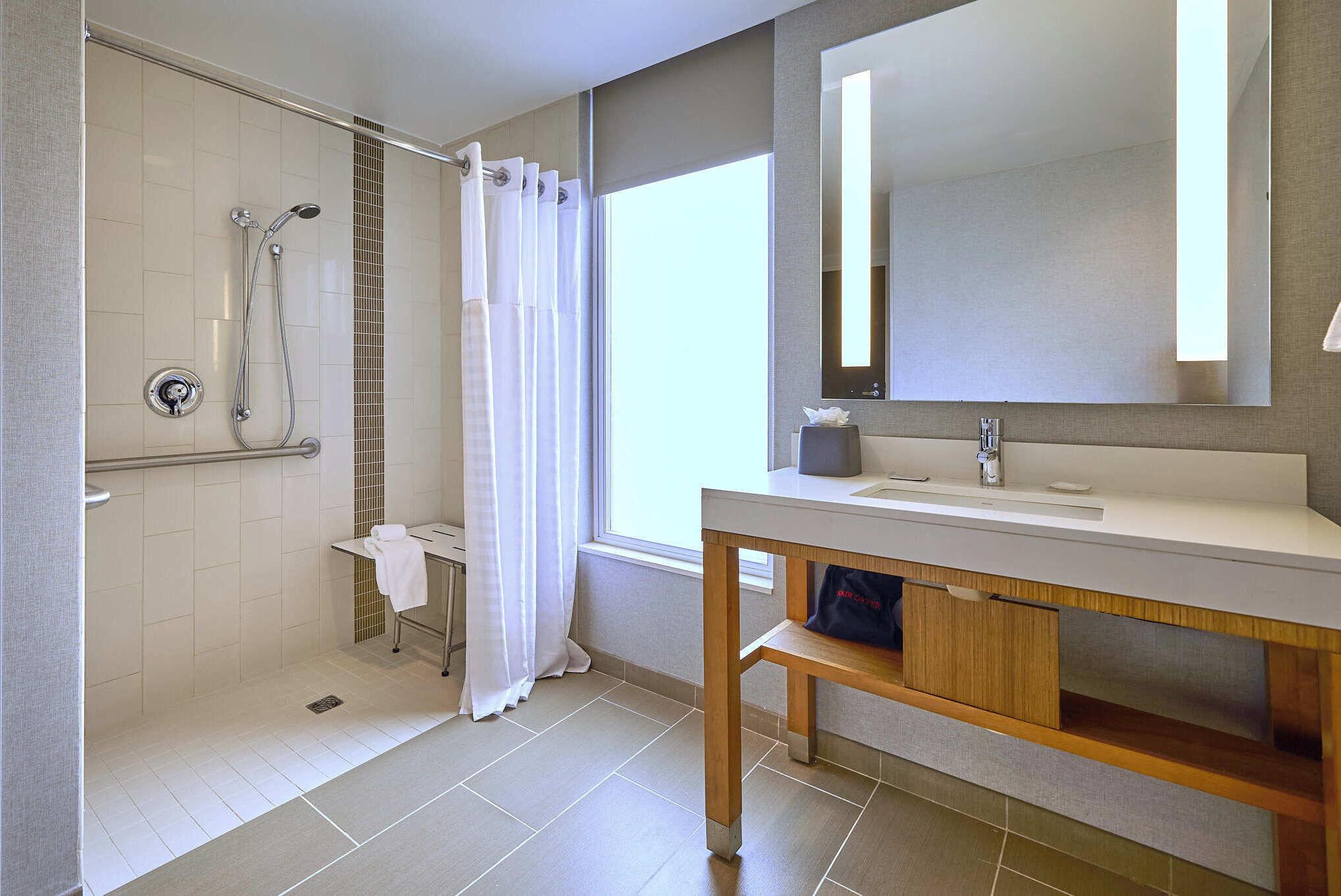 suite, 1 bedroom, accessible (shower) | bathroom | shower, designer toiletries, hair dryer, towels