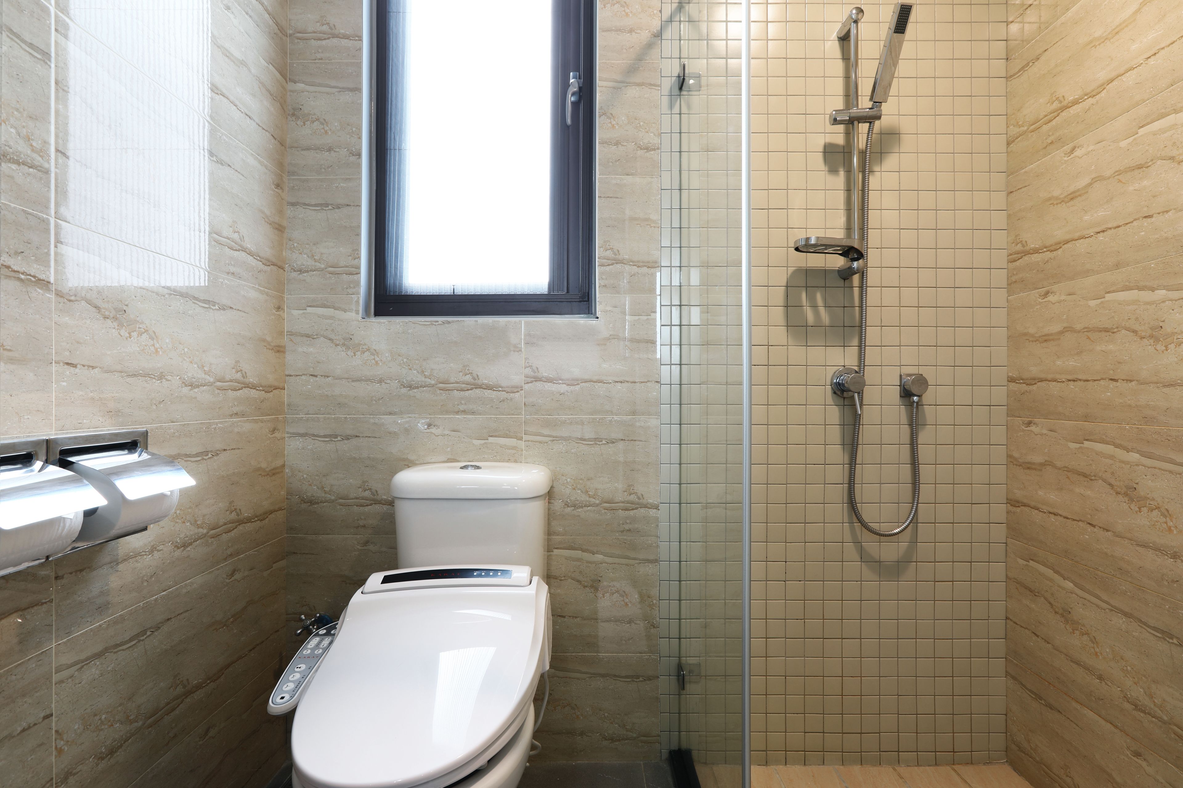 standard double room | bathroom | shower, hair dryer, towels, toilet paper