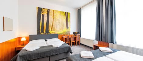 Standard Quadruple Room | Desk, blackout drapes, free WiFi, bed sheets