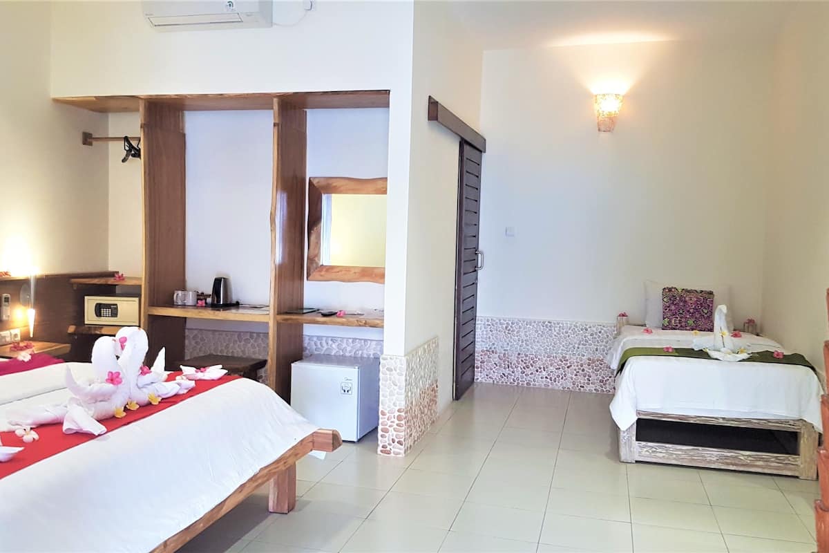 Triple Deluxe Room | Ropa de cama de alta calidad y minibar