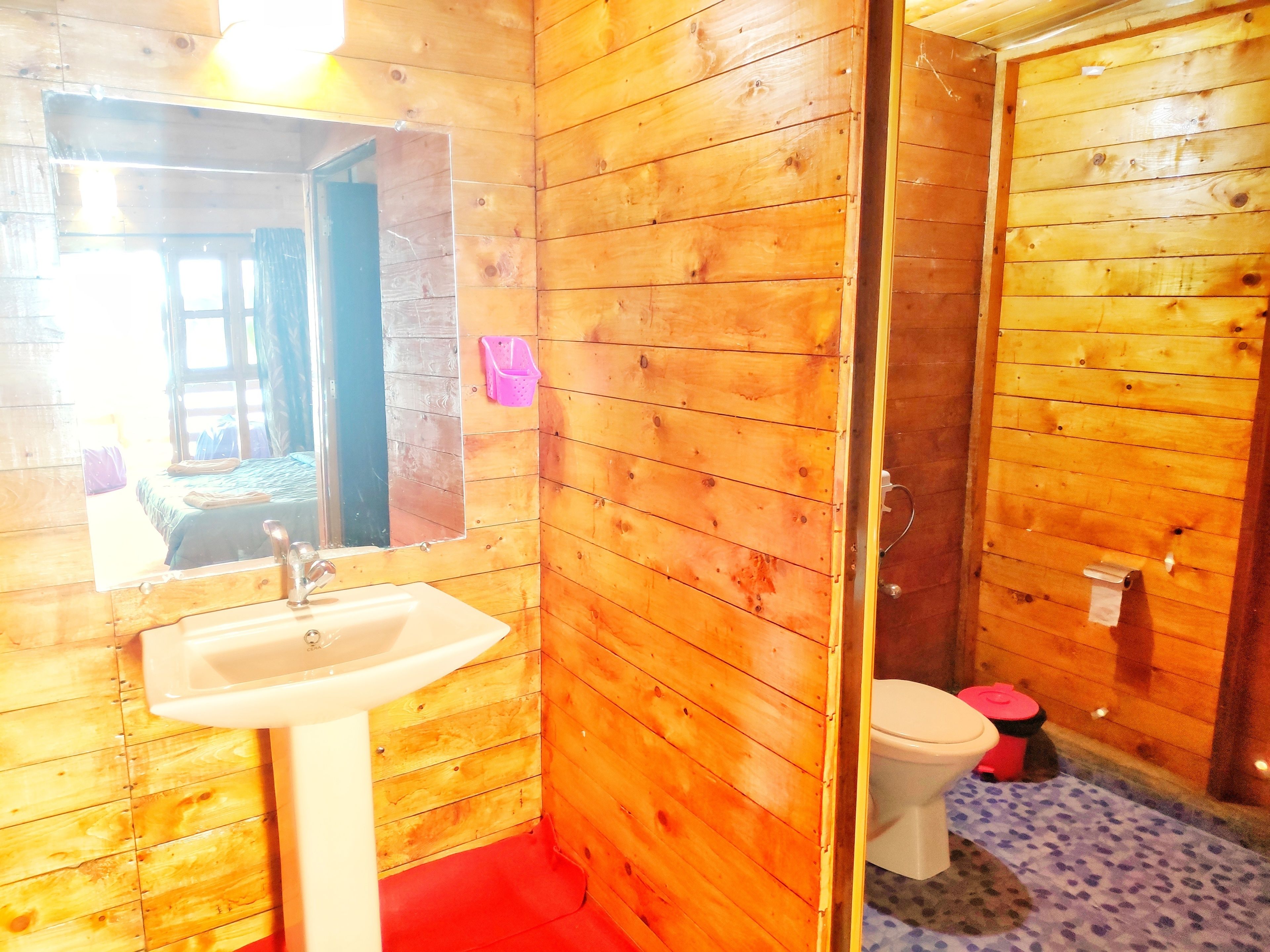 deluxe ac sea facing high rise hut | bathroom | shower, towels