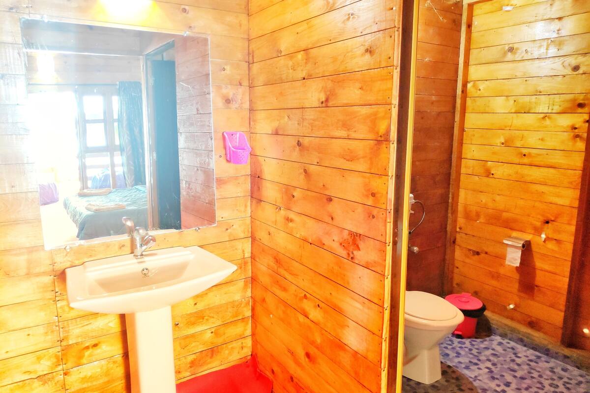 deluxe ac sea facing high rise hut | bathroom | shower, towels