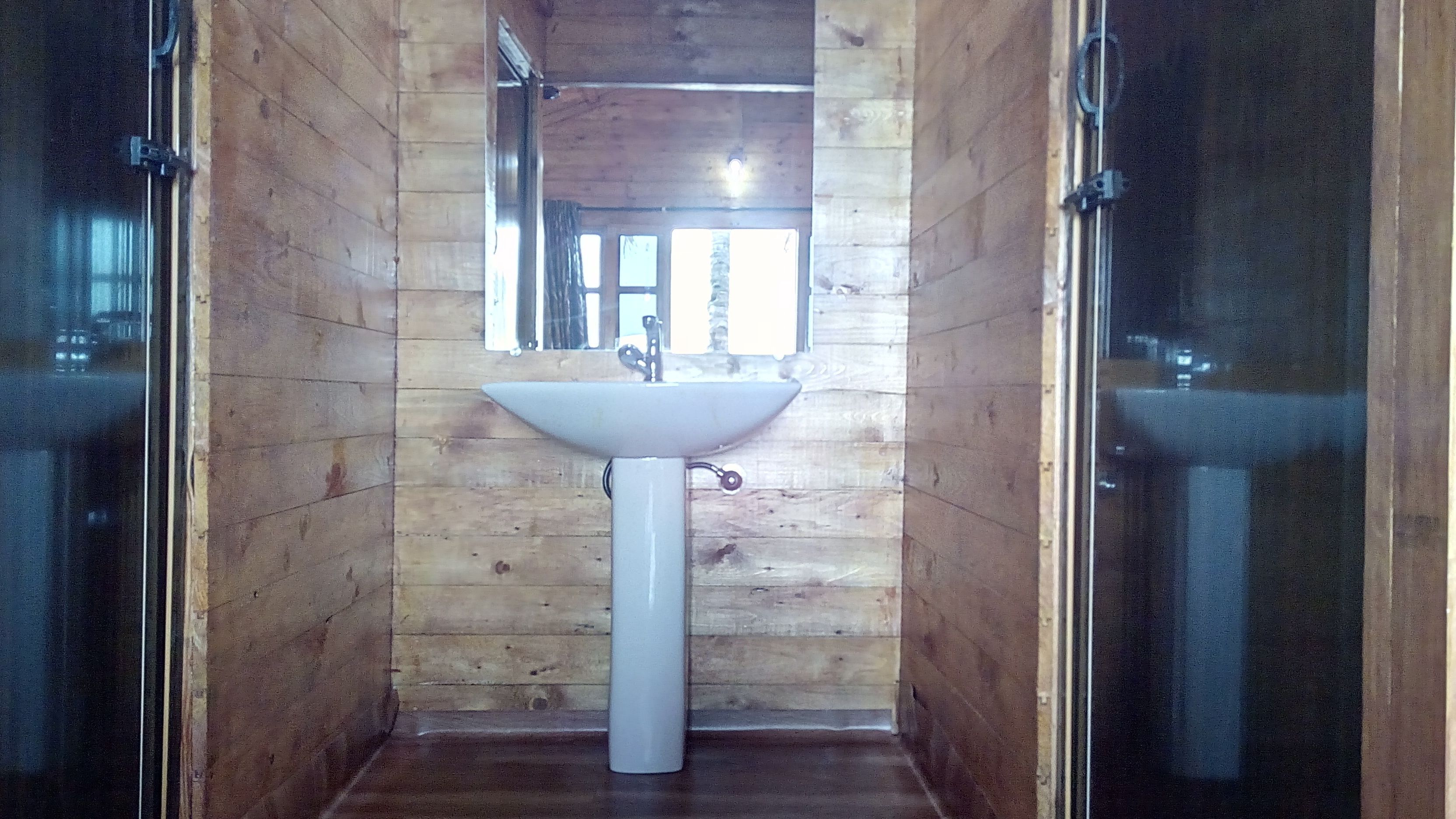 deluxe ac sea facing high rise hut | bathroom sink