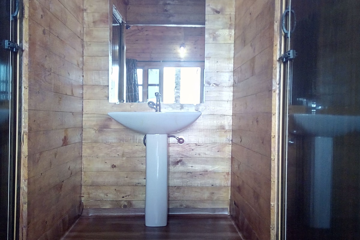 deluxe ac sea facing high rise hut | bathroom sink