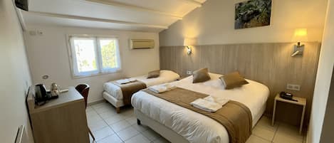 Standard Triple Room | Premium bedding, in-room safe, desk, blackout drapes