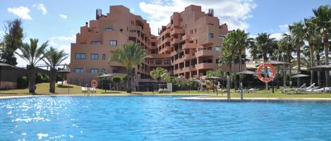 Seasonal outdoor pool, pool umbrellas, sun loungers
