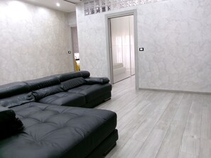 Family Condo, Non Smoking, City View | Living area | Flat-screen TV