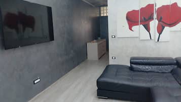 Family Condo, Non Smoking, City View | Living area | Flat-screen TV